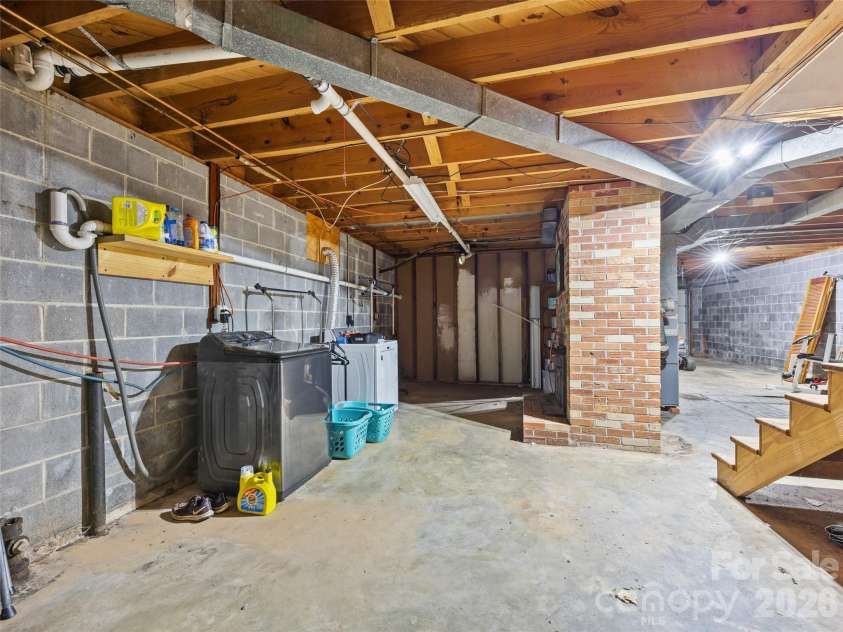 50 Baldwin Road, Arden, NC 28704.  MLS# CAR4402353, YatesRealty ID 14376. Unfinished Basement with Rough-In for optional 2nd Bathroom.