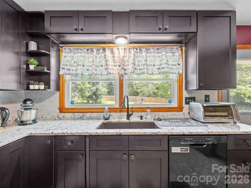 50 Baldwin Road, Arden, NC 28704.  MLS# CAR4402353, YatesRealty ID 14376. Window View of Backyard