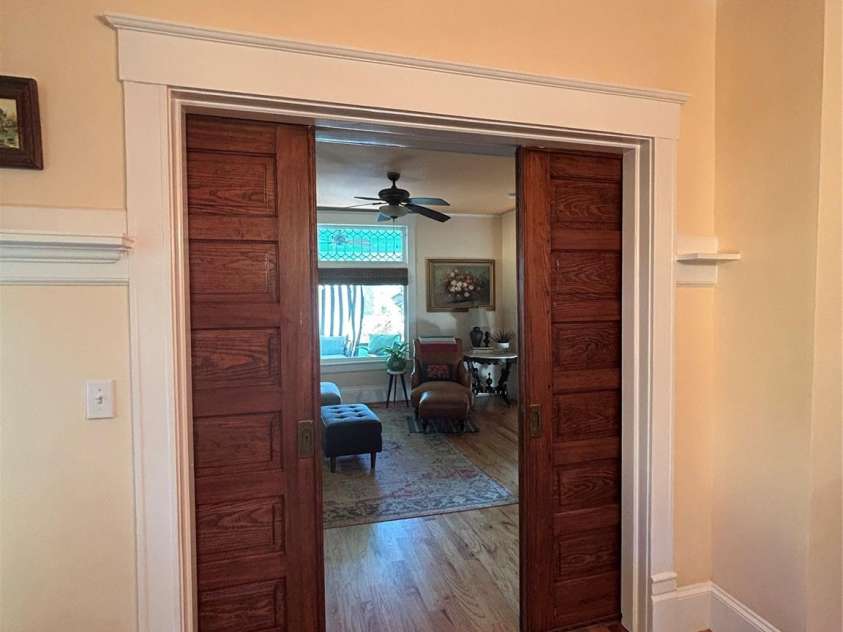 1000 Margaret Brown Street, Charlotte, NC 28202.  MLS# CAR4244039, YatesRealty ID 14379. Fully functional original pocket doors - one set between living dining/ the other between living / foyer