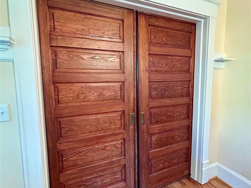 1000 Margaret Brown Street, Charlotte, NC 28202.  MLS# CAR4244039, YatesRealty ID 14379. Fully functional original pocket doors - one set between living dining/ the other between living / foyer