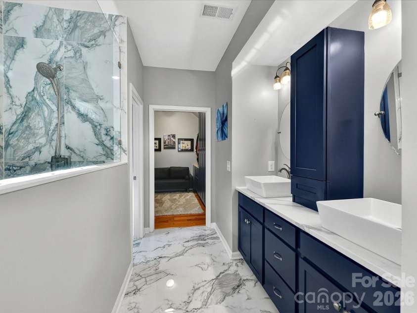 5095 Samoa Ridge Drive, Lancaster, SC 29720.  MLS# CAR4357204, YatesRealty ID 14379. Customized Bath with Remodeled Vanity with Linen Tower, and Two Vessel Sinks, Mirrors and Fixtures
