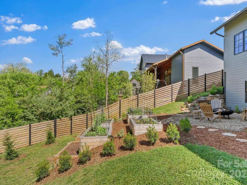 52 Malvern Walk, Asheville, NC 28806.  MLS# CAR4257541, YatesRealty ID 1439. Tiered Garden Beds, planted for summer havest