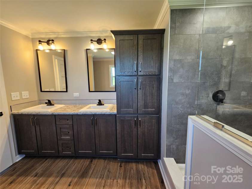 784 Severt Circle, Lenoir, NC 28645.  MLS# CAR4228434, YatesRealty ID 14393. Double Sink Vanity and Linen Cabinet in Master Bathroom