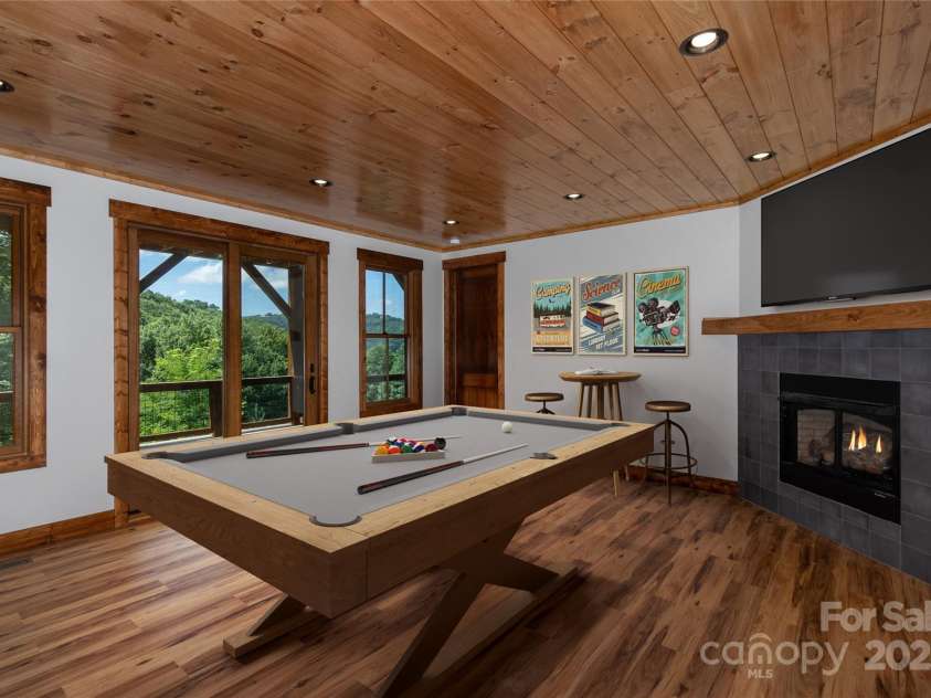 750 Silver Springs Drive, Banner Elk, NC 28604.  MLS# CAR4160928, YatesRealty ID 144. Family/game room with gas fireplace