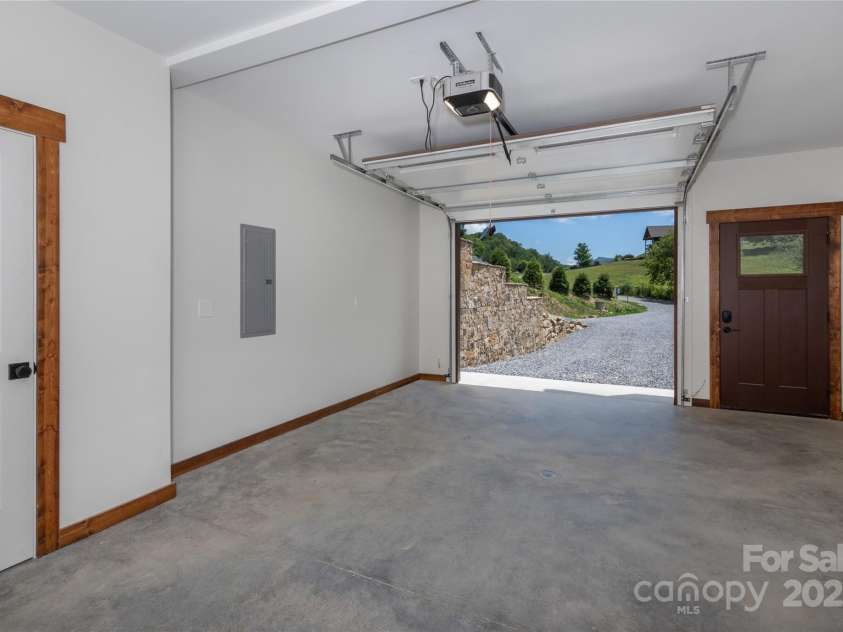 750 Silver Springs Drive, Banner Elk, NC 28604.  MLS# CAR4160928, YatesRealty ID 144. One car garage with service door and storage on basement level