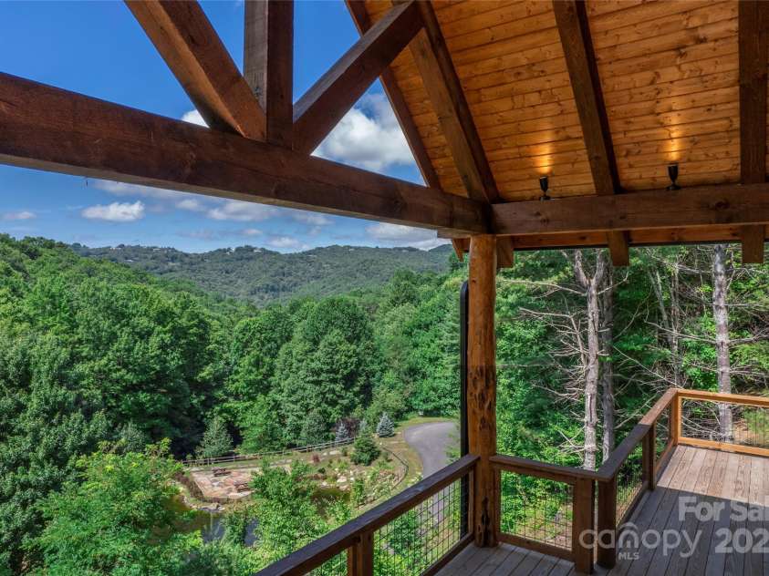 750 Silver Springs Drive, Banner Elk, NC 28604.  MLS# CAR4160928, YatesRealty ID 144. Over 1,200 square feet of outdoor space including main level porte-cochere, covered porches with majestic, private mountain & neighborhood pond views