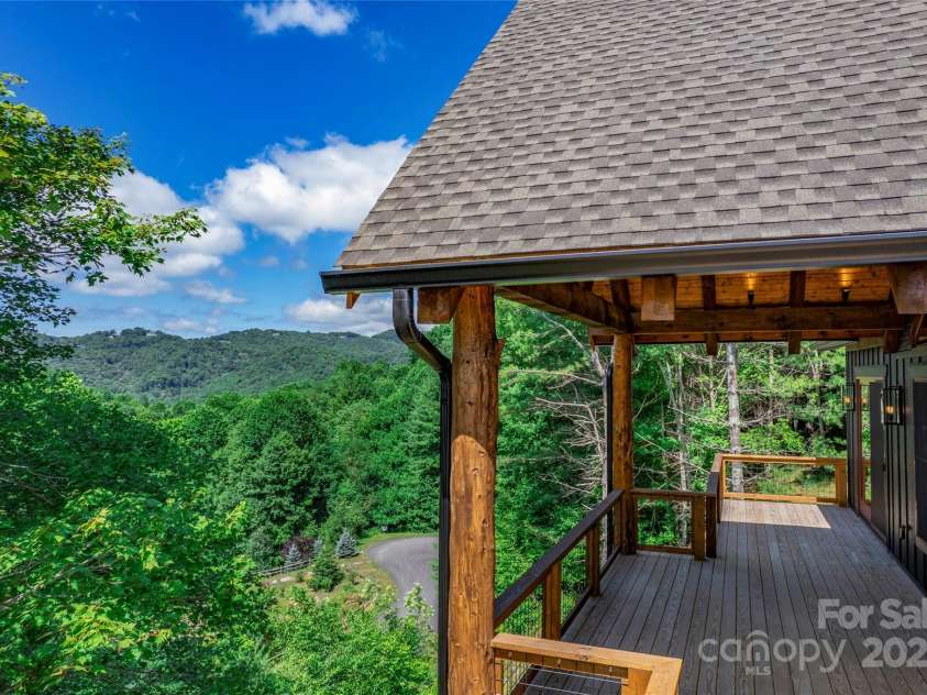 750 Silver Springs Drive, Banner Elk, NC 28604.  MLS# CAR4160928, YatesRealty ID 144. Over 1,200 square feet of outdoor space including main level porte-cochere, covered porches with majestic, private mountain & neighborhood pond views