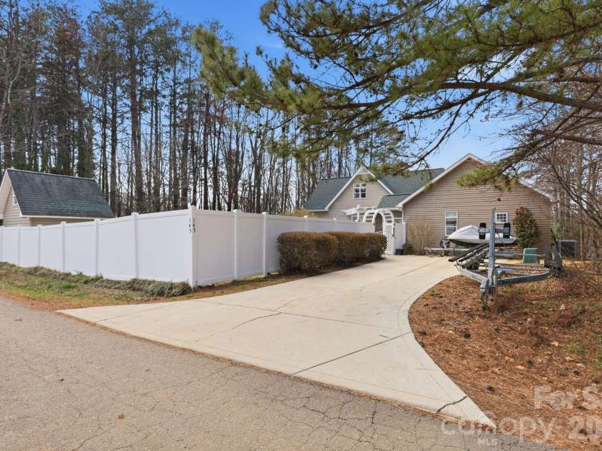 145 Morgan Bluff Road, Mooresville, NC 28117.  MLS# CAR4344802, YatesRealty ID 14400. Additional driveway offering expanded parking and access.
