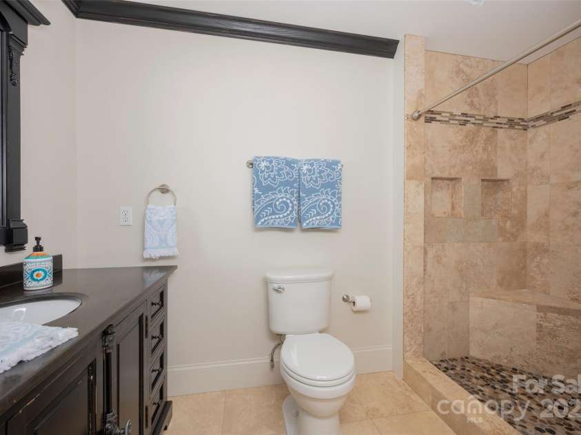 153 Finn Hollow Lane, Advance, NC 27006.  MLS# CAR4241337, YatesRealty ID 14402. Apartment Bathroom in finished basement (1 of 2 bathrooms)