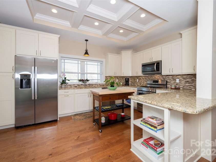 153 Finn Hollow Lane, Advance, NC 27006.  MLS# CAR4241337, YatesRealty ID 14402. Basement Apartment features Stainless Steel Appliances including Side-by-Side Refrigerator/Freezer, Dishwasher, Gas Range/Oven, Granite Countertops, Coffered Ceiling