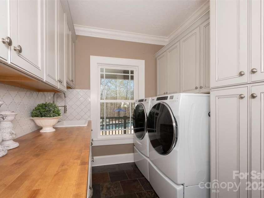 153 Finn Hollow Lane, Advance, NC 27006.  MLS# CAR4241337, YatesRealty ID 14402. Laundry Room appliances (Whirpool Washer/Dryer front loading set on pedestals) included.