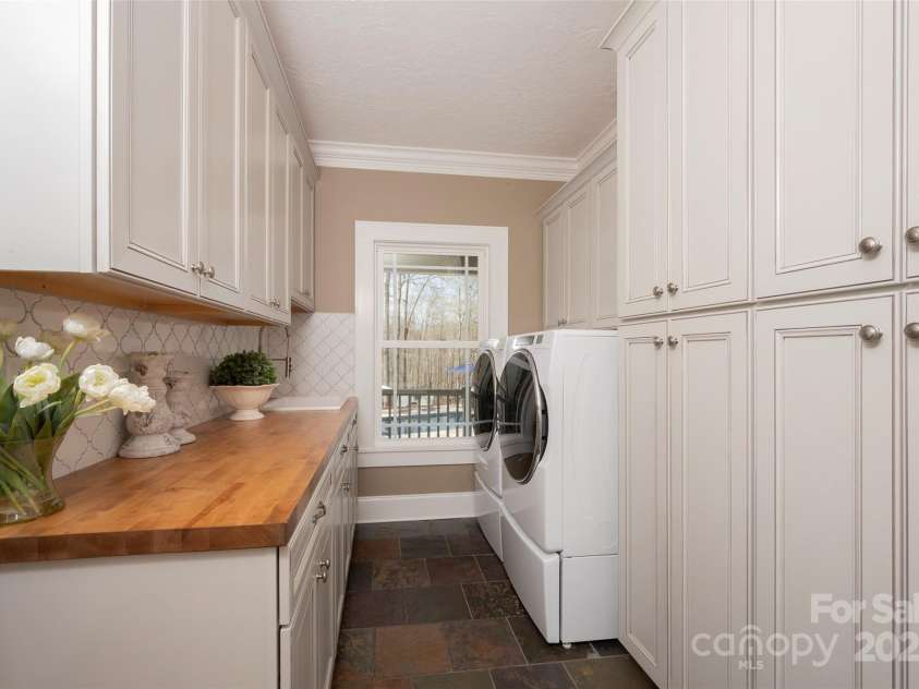 153 Finn Hollow Lane, Advance, NC 27006.  MLS# CAR4241337, YatesRealty ID 14402. Pantry Cabinets for small appliance storage, shoes, baskets, cleaning supplies, etc...