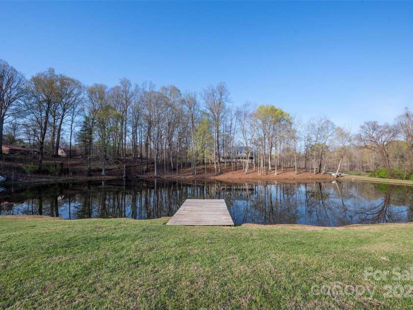 153 Finn Hollow Lane, Advance, NC 27006.  MLS# CAR4241337, YatesRealty ID 14402. Private Pond, stocked with Bass, Brim, and Koi Fish