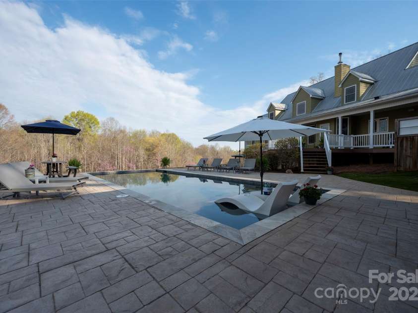 153 Finn Hollow Lane, Advance, NC 27006.  MLS# CAR4241337, YatesRealty ID 14402. Stamped Concrete Pool Deck
