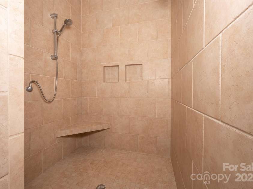 153 Finn Hollow Lane, Advance, NC 27006.  MLS# CAR4241337, YatesRealty ID 14402. Tiled Shower
