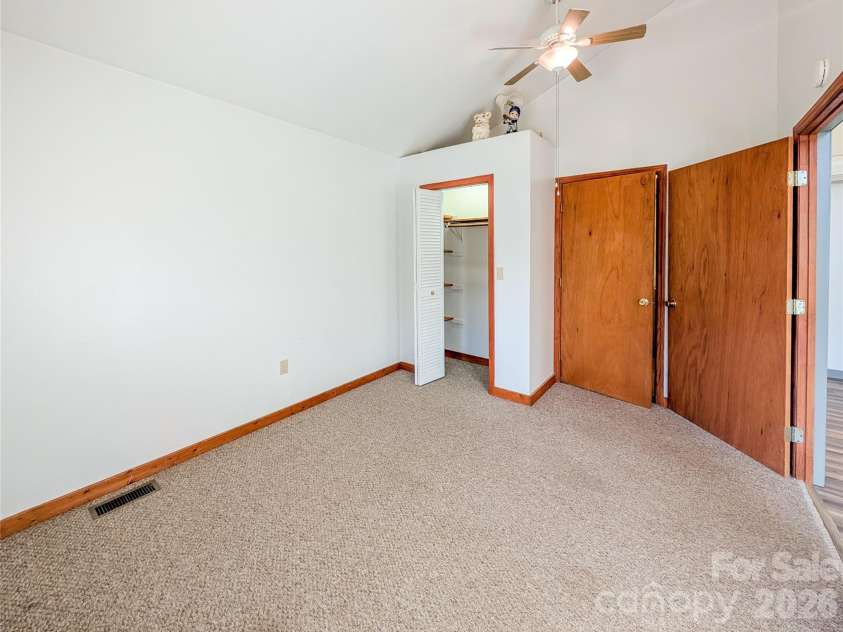 65 Happy Hollow Road, Green Mountain, NC 28740.  MLS# CAR4363965, YatesRealty ID 14402. Additional View of Primary Bedroom with Access to Full Bathroom on Upper Level