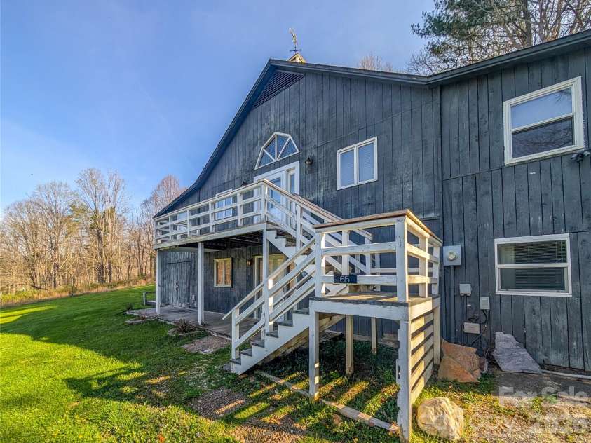 65 Happy Hollow Road, Green Mountain, NC 28740.  MLS# CAR4363965, YatesRealty ID 14402. Front of Home access to upper level from inside or deck. 