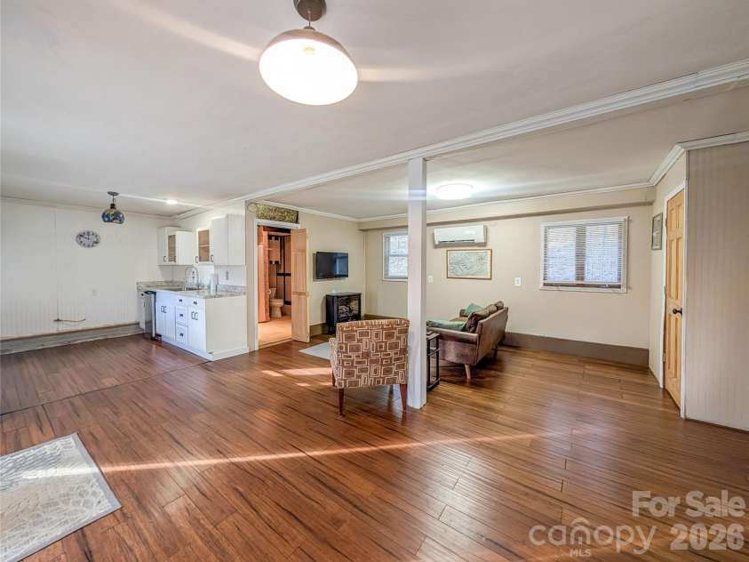 65 Happy Hollow Road, Green Mountain, NC 28740.  MLS# CAR4363965, YatesRealty ID 14402. Main level of home with flex space, partial kitchen full bath, laundry and bedroom