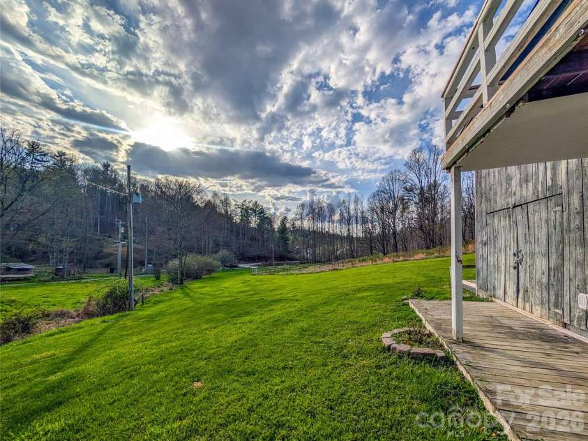 65 Happy Hollow Road, Green Mountain, NC 28740.  MLS# CAR4363965, YatesRealty ID 14402. View from main level entrance to home of acreage