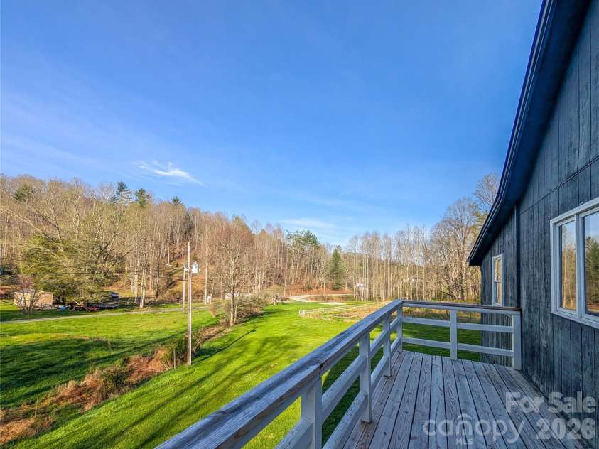 65 Happy Hollow Road, Green Mountain, NC 28740.  MLS# CAR4363965, YatesRealty ID 14402. View of property from deck on upper level of home