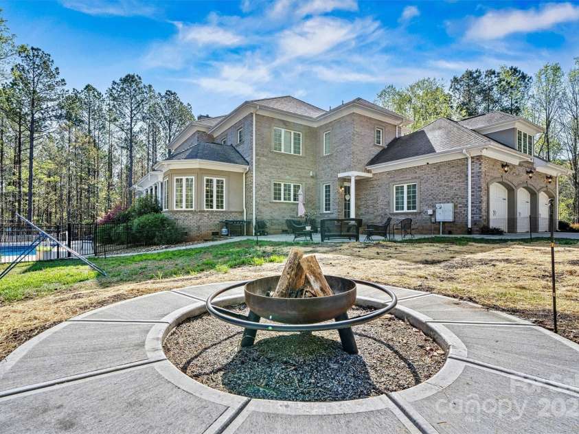 7509 Webbs Chapel Cove Court, Denver, NC 28037.  MLS# CAR4234853, YatesRealty ID 14408. Backyard firepit area