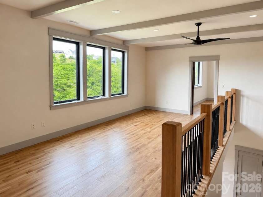 25 Emory Paige Road, Weaverville, NC 28787.  MLS# CAR4332863, YatesRealty ID 14417. Spacious loft overlooking the great room below