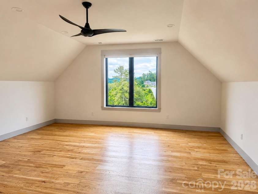 25 Emory Paige Road, Weaverville, NC 28787.  MLS# CAR4332863, YatesRealty ID 14417. Versatile bonus room ideal for media, fitness, hobbies, or guests