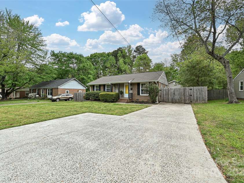 3701 Slagle Drive, Charlotte, NC 28215.  MLS# CAR4243621, YatesRealty ID 14417. Double parking in front of private, fenced driveway