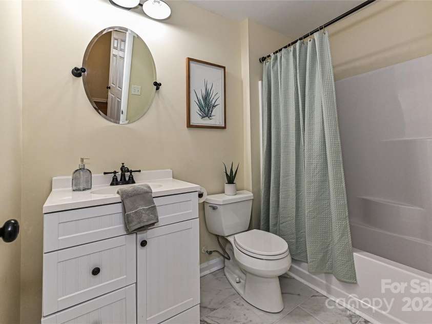 3701 Slagle Drive, Charlotte, NC 28215.  MLS# CAR4243621, YatesRealty ID 14417. Hall bathroom totally updated with new tile floors