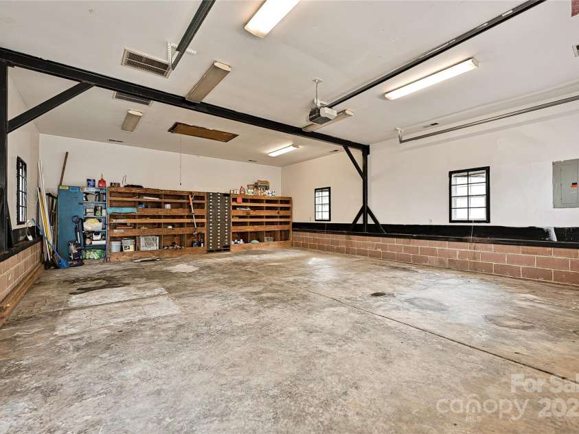 3701 Slagle Drive, Charlotte, NC 28215.  MLS# CAR4243621, YatesRealty ID 14417. MASSIVE garage with reinforced steel beam. Separate utility meter and HVAC- perfect for an ADU