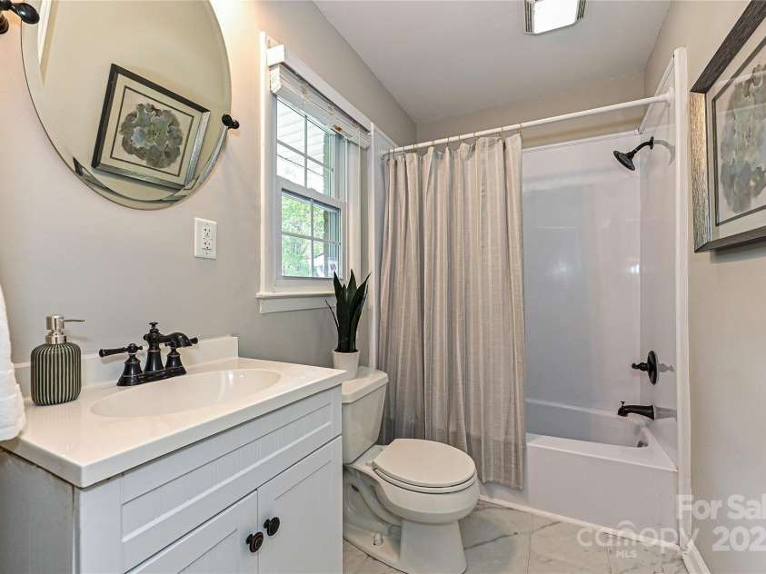 3701 Slagle Drive, Charlotte, NC 28215.  MLS# CAR4243621, YatesRealty ID 14417. Updated bathrooms w new tile
