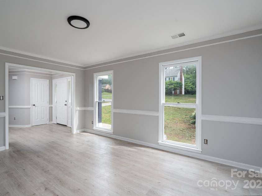 1013 Doby Springs Drive, Charlotte, NC 28262.  MLS# CAR4259903, YatesRealty ID 14420. Living room without Staging