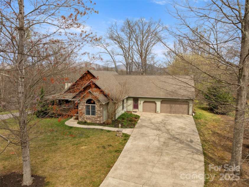 303 Forest Place, Candler, NC 28715.  MLS# CAR4245999, YatesRealty ID 14422. 