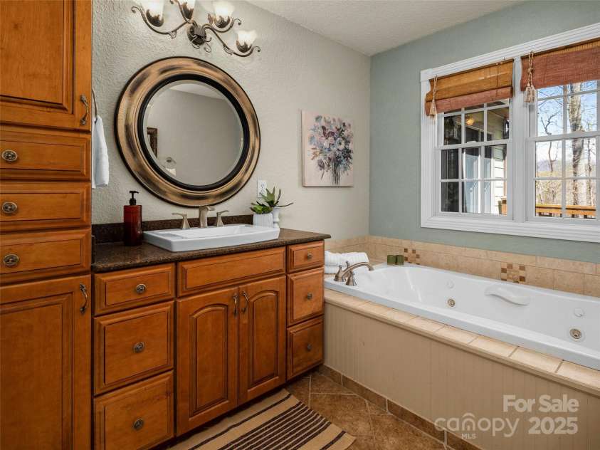 303 Forest Place, Candler, NC 28715.  MLS# CAR4245999, YatesRealty ID 14422. 