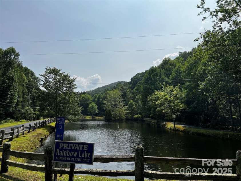 376 Overlook Drive, Burnsville, NC 28714.  MLS# CAR4247465, YatesRealty ID 14424. Pond below