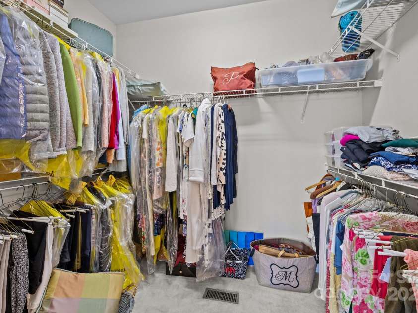 7815 Scottsburg Court, Mint Hill, NC 28227.  MLS# CAR4247667, YatesRealty ID 14426. Is this enough room for you?P rimary closet is 6.4' x 8.7' with an organization system that maximizes the space. This up-close photo doesn't do it justice!
