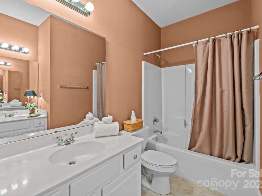 7815 Scottsburg Court, Mint Hill, NC 28227.  MLS# CAR4247667, YatesRealty ID 14426. Magic mirror, what do I see? A second vanity in this hall Bath, courtesy of a pocket door!