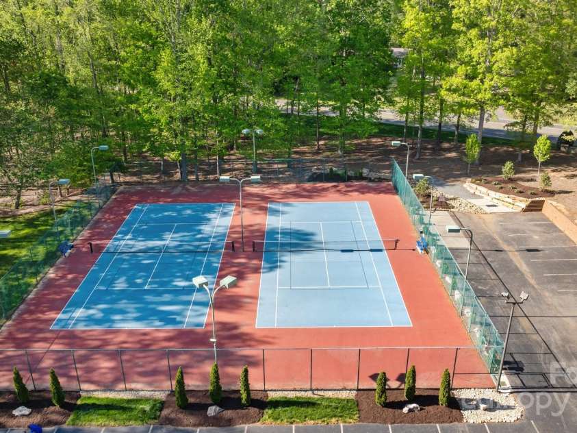 7815 Scottsburg Court, Mint Hill, NC 28227.  MLS# CAR4247667, YatesRealty ID 14426. Tennis/pickleball anyone??  Won't it be nice to play in the shade for a change!