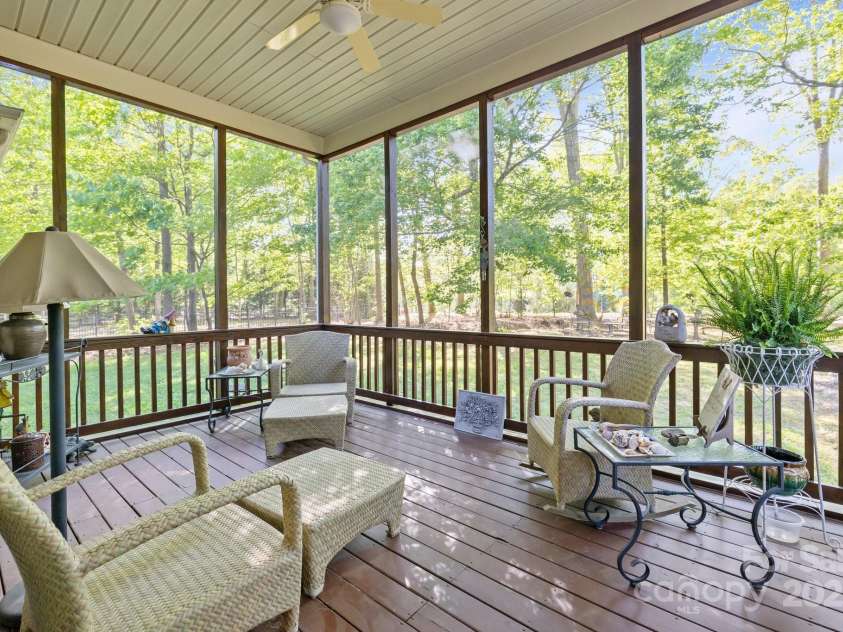 7815 Scottsburg Court, Mint Hill, NC 28227.  MLS# CAR4247667, YatesRealty ID 14426. What will complete your wish list? I know--this beautiful 13' x 16.7' screened porch? Endless morning coffees and wine-down evenings are in your future!