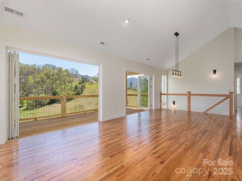 191 Aster Ridge Drive, Waynesville, NC 28786.  MLS# CAR4248737, YatesRealty ID 14439. All 6 panels open up to the view and porch