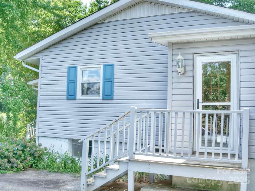 200 Frost Road, Saluda, NC 28773.  MLS# CAR4186727, YatesRealty ID 14440. Side entrance by garage