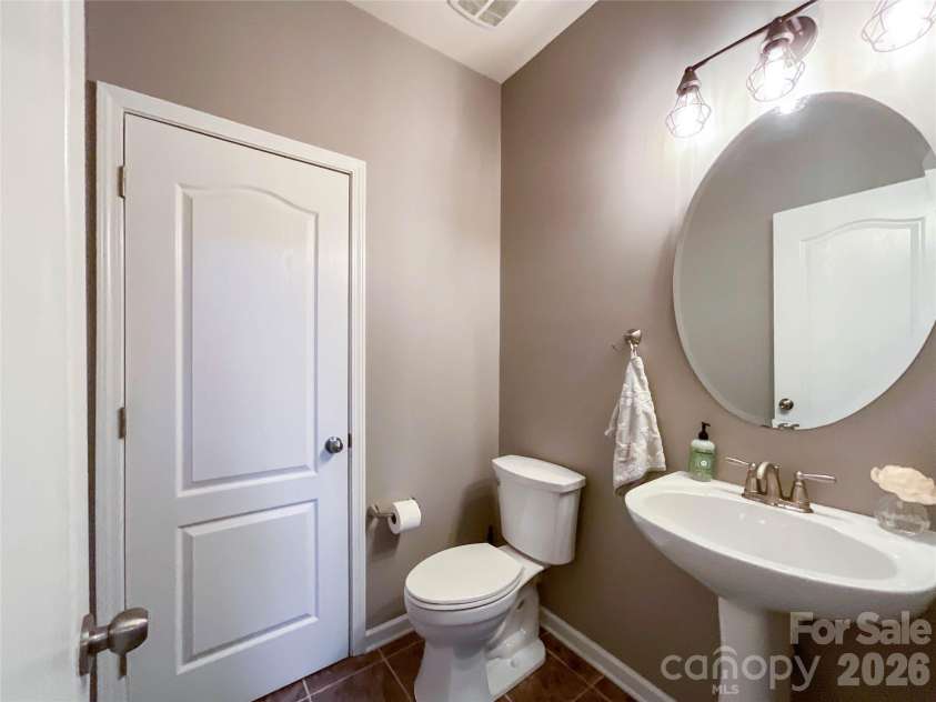 1300 Afternoon Sun Road, Matthews, NC 28104.  MLS# CAR4351669, YatesRealty ID 14448. Half bath