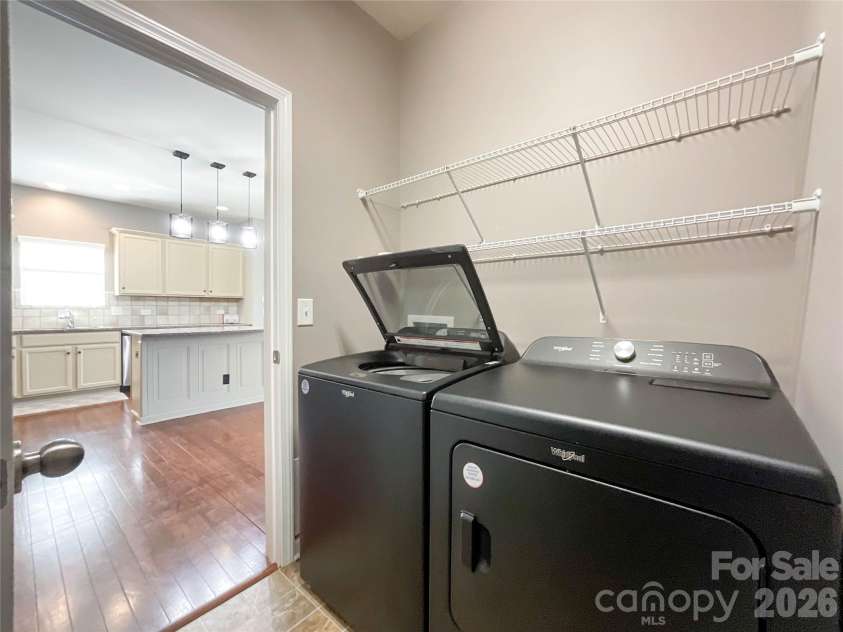 1300 Afternoon Sun Road, Matthews, NC 28104.  MLS# CAR4351669, YatesRealty ID 14448. Main floor laundry 