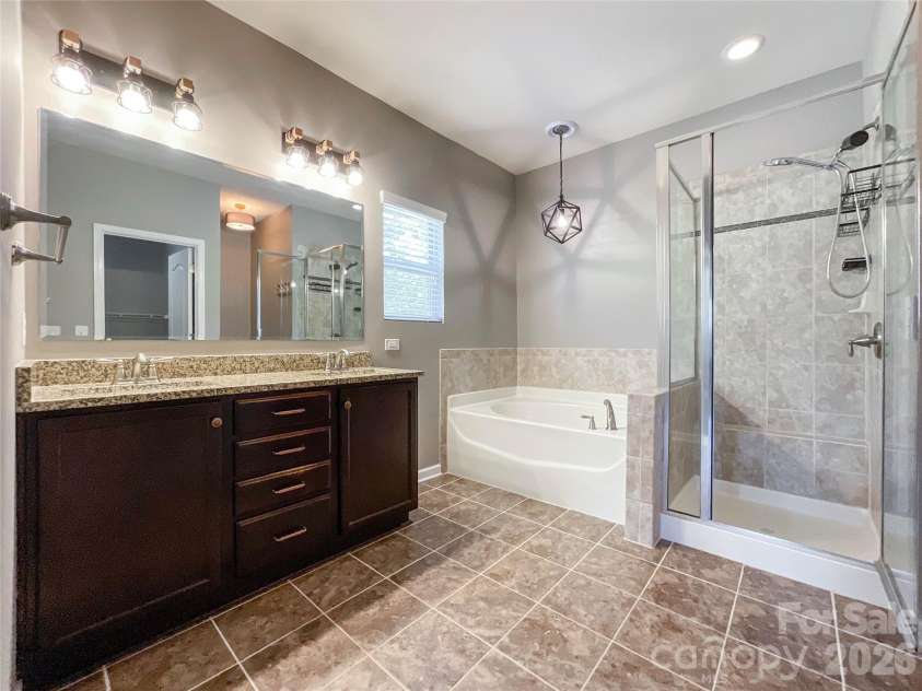 1300 Afternoon Sun Road, Matthews, NC 28104.  MLS# CAR4351669, YatesRealty ID 14448. Primary Bathroom 