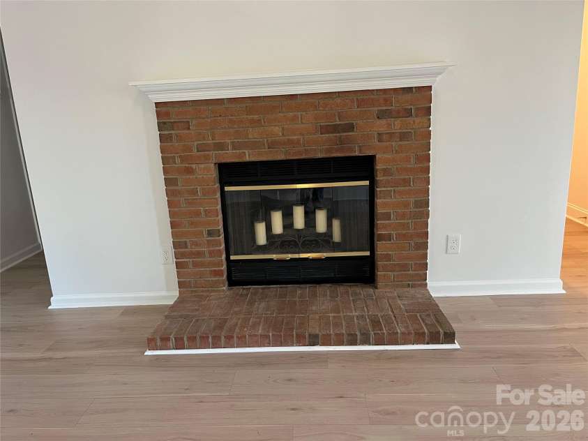 10324 Bon Meade Lane, Cornelius, NC 28031.  MLS# CAR4356891, YatesRealty ID 14450. Brick Wood Burning Fireplace