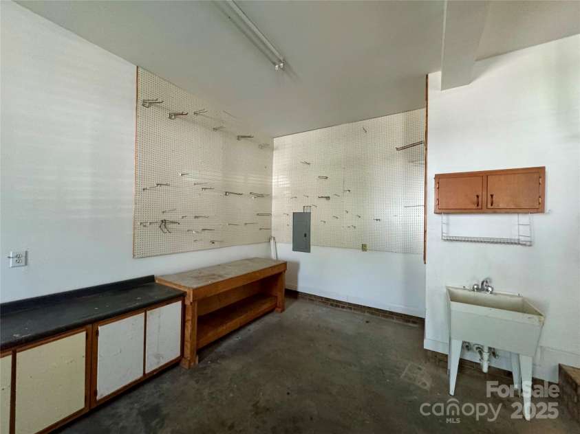 1043 Cambrook Court, Concord, NC 28027.  MLS# CAR4259122, YatesRealty ID 14451. Workshop area in garage with laundry sink