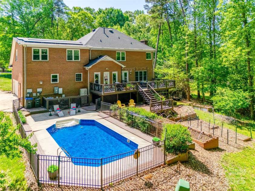 7122 Forest Ridge Road, Matthews, NC 28104.  MLS# CAR4249033, YatesRealty ID 14454. In ground Pool  and garden beds with great soil ready for planting