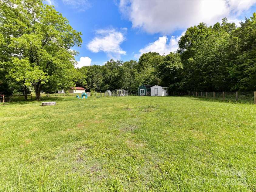 915 Gate Road, Monroe, NC 28112.  MLS# CAR4245908, YatesRealty ID 14460. Expansive backyard