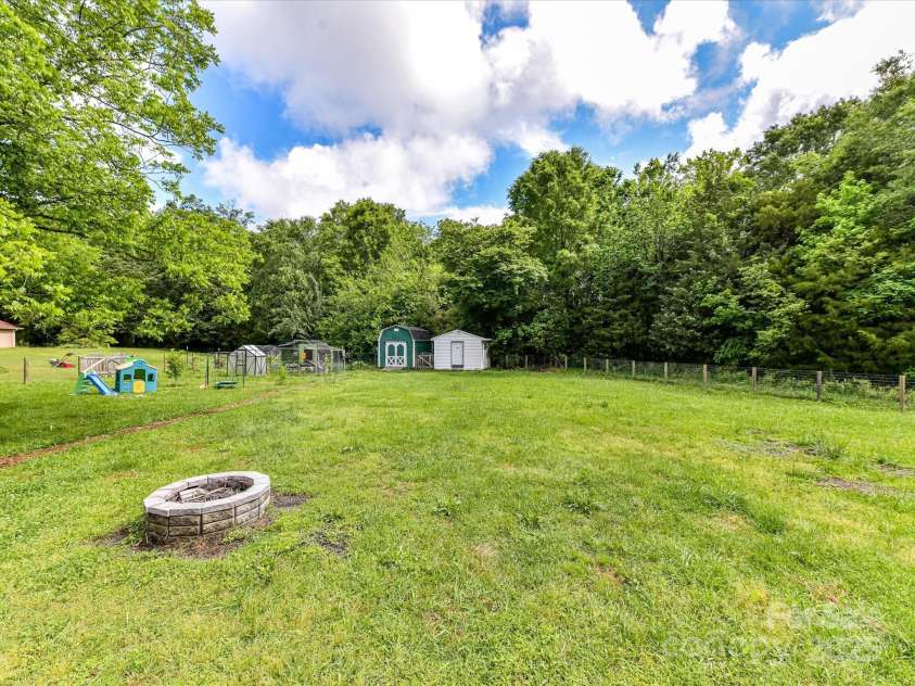 915 Gate Road, Monroe, NC 28112.  MLS# CAR4245908, YatesRealty ID 14460. Firepit