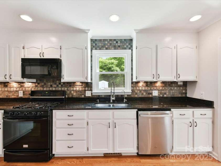 915 Gate Road, Monroe, NC 28112.  MLS# CAR4245908, YatesRealty ID 14460. Imagine doing dishes at this sink, overlooking the expansive deck and backyard